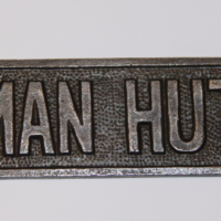MAN HUT Cast Iron Plaque